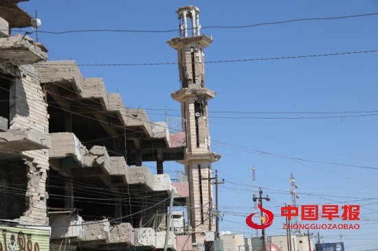 这是3月12日在伊拉克费卢杰拍摄的在美军入侵费卢杰时被炸毁的建筑。新华社发(哈利勒·达伍德摄)